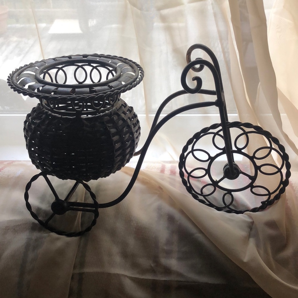 Heavy wrought iron tricycle planter. Woven basket. Beautiful decor